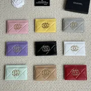 Chanel card holder with chain detail. #B45527