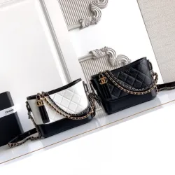 Chanel Women's Bucket Bag - Black & White Quilted Leather, Gold-Tone CC Logo & Two-Tone Chain Strap, Stylish Crossbody Bag for Luxury Fashion #B56725