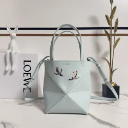 Loewe Women's Mini Bucket Bag - Light Blue Leather with Penguin Embroidery, Convertible Handle & Crossbody Strap, Playful Luxury Handbag with Anagram Logo #B56831 Loewe Women's Mini Bucket Bag - Light Blue Leather with Penguin Embroidery, Convertible Handle & Crossbody Strap, Playful Luxury Handbag with Anagram Logo #B56831