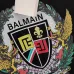 Balmain Paris White/Black T Shirt with Gold Chain and Blue Ribbon Circular Graphic Design for Men #B54209