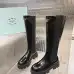 Prada's Sleek Black Knee-High Boots Featuring Glossy Texture and Iconic Logo #B54538