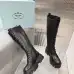 Prada's Stylish Black Lace-Up Knee-High Boots with Chunky Soles on Display #B54539