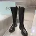 Prada's Stylish Black Lace-Up Knee-High Boots with Chunky Soles on Display #B54539