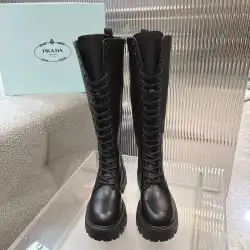 Prada's Stylish Black Lace-Up Knee-High Boots with Chunky Soles on Display #B54539