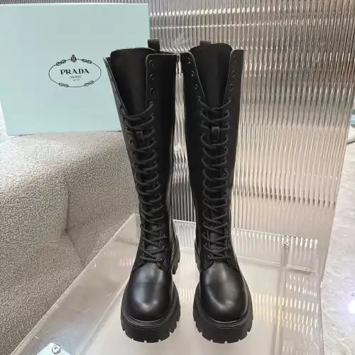 Prada's Stylish Black Lace-Up Knee-High Boots with Chunky Soles on Display #B54539