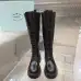 Prada's Stylish Black Lace-Up Knee-High Boots with Chunky Soles on Display #B54539