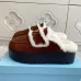 Prada Women's Shearling Lined Mule Slippers Triangle Logo Thick Sole Design for Cozy Luxury Winter Footwear #B57746