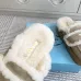 Prada Women's Shearling Lined Mule Slippers Triangle Logo Thick Sole Design for Cozy Luxury Winter Footwear #B57747