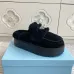Prada Women's Shearling Lined Mule Slippers Triangle Logo Thick Sole Design for Cozy Luxury Winter Footwear #B57748