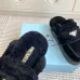 Prada Women's Shearling Lined Mule Slippers Triangle Logo Thick Sole Design for Cozy Luxury Winter Footwear #B57748