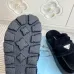Prada Women's Shearling Lined Mule Slippers Triangle Logo Thick Sole Design for Cozy Luxury Winter Footwear #B57748