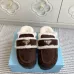 Prada Women's Shearling Lined Mule Slippers Triangle Logo Thick Sole Design for Cozy Luxury Winter Footwear #B57749