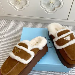 Prada Women's Shearling Lined Mule Slippers Triangle Logo Thick Sole Design for Cozy Luxury Winter Footwear #B57750