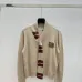 2025  Miu Miu Women's Striped Knit Polo Sweater with a Quarter-Zip or Button Placket and Miu Miu Logo #B54795