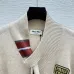 2025  Miu Miu Women's Striped Knit Polo Sweater with a Quarter-Zip or Button Placket and Miu Miu Logo #B54795