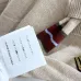 2025  Miu Miu Women's Striped Knit Polo Sweater with a Quarter-Zip or Button Placket and Miu Miu Logo #B54795