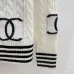 CHANEL Women's Luxury Cable Knit Cardigan  Featuring Bold Signature Double C Logo Intarsia and Contrast Striped Trims #B56312
