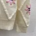 Chanel Women's Knitted Sweaters: Floral   CC Logo Embroidery with Argyle Design for Luxury Fashion Lovers #B56270