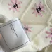 Chanel Women's Knitted Sweaters: Floral   CC Logo Embroidery with Argyle Design for Luxury Fashion Lovers #B56270